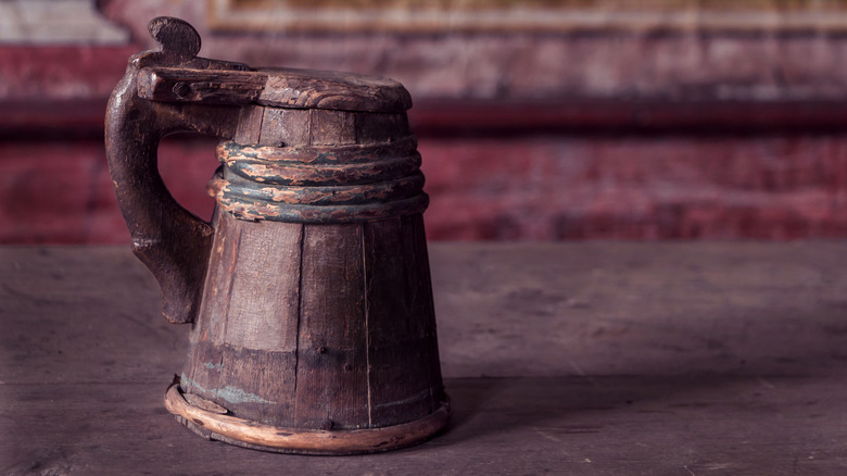 worn wooden beer stein