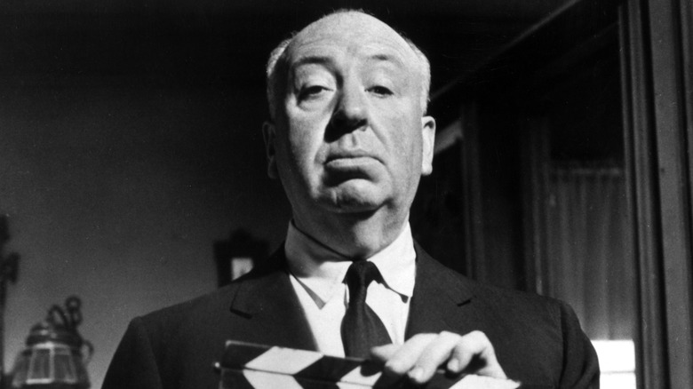 Alfred Hitchcock wearing a suit and tie