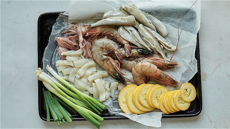 sliced vegetables on a sheet tray