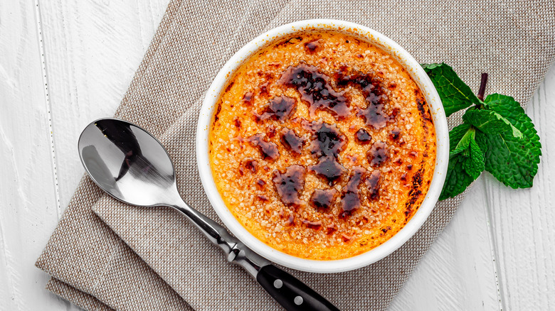 creme brulee with napkin and spoon