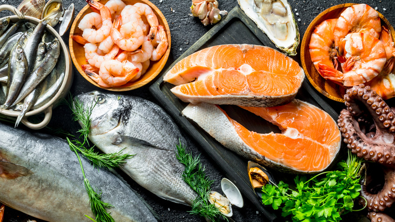 assortment of raw and cooked seafood