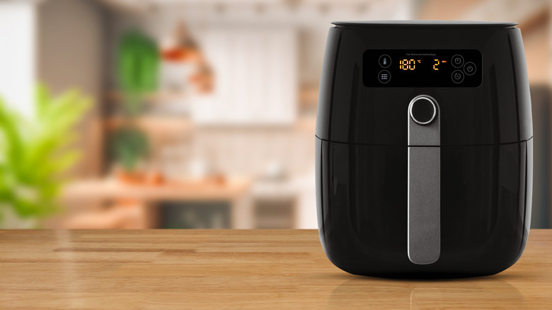 Air fryer on wood countertop