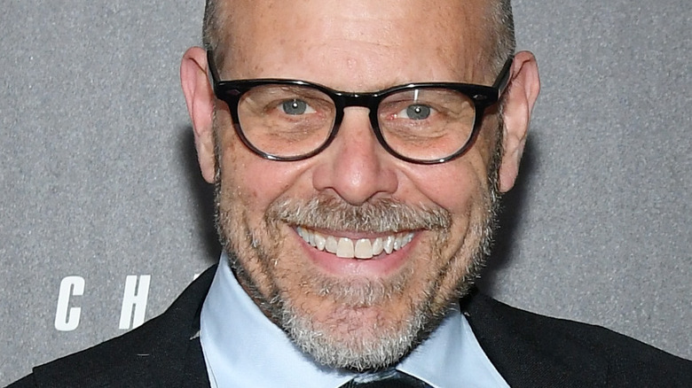 Alton Brown smiling on red carpet event
