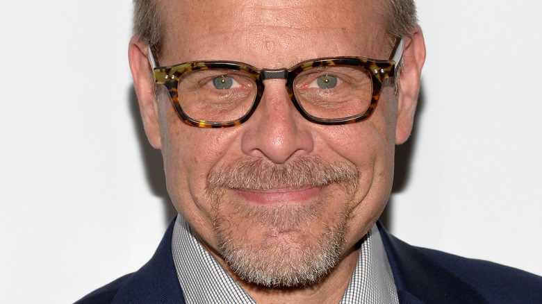 Alton Brown smiling on red carpet