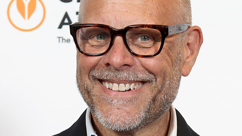 Alton Brown smiling on red carpet