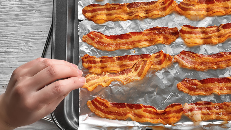Cooking bacon on a tray lined with foil