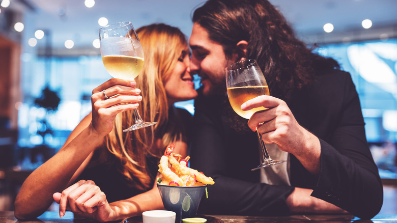 Romantic couple drinking wine