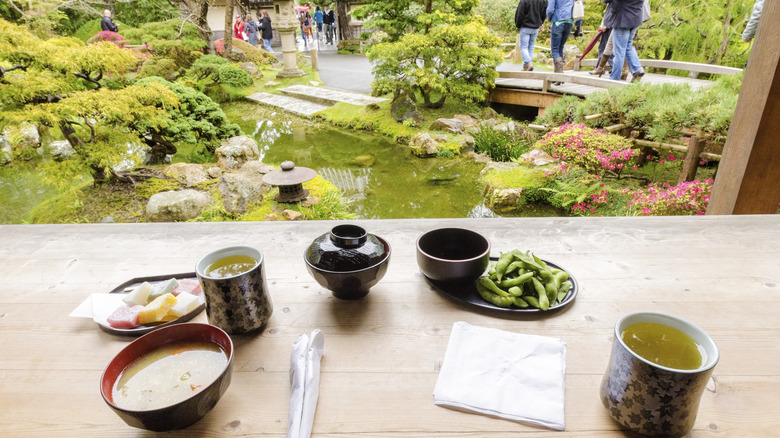 View out from inside the tea house at San Francisco's Japanese Tea Garden, with tea and snacks on the table.