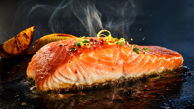 salmon fillet cooking in hot oil