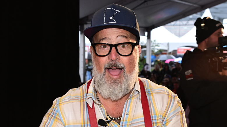 Andrew Zimmern smiling