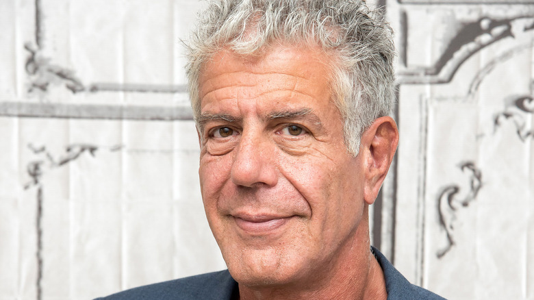 A photo of Anthony Bourdain smiling.