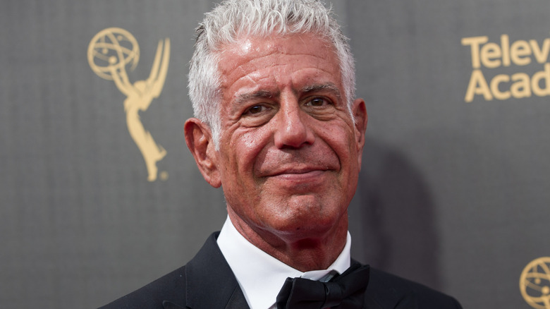 Anthony Bourdain smiling in a tux