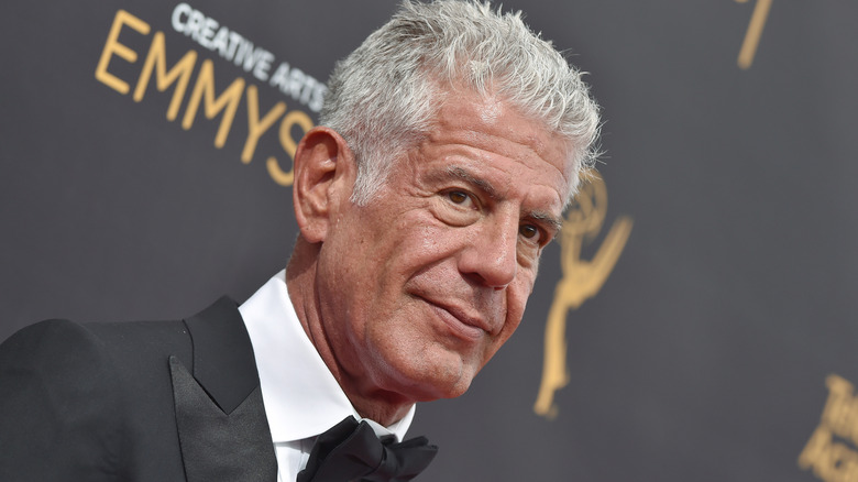 Anthony Bourdain appears on a red carpet for the Creative Arts Emmys