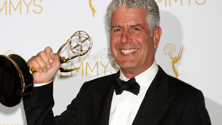 Anthony Bourdain with an Emmy award