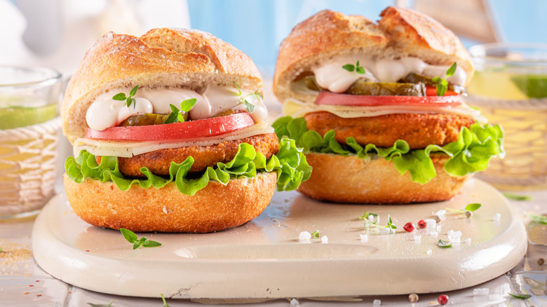 Fish burgers served on a cutting board