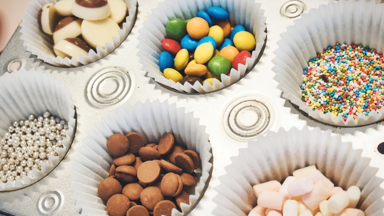 Muffin tin filled with ice cream toppings