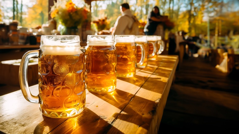 row of beer mugs on a table