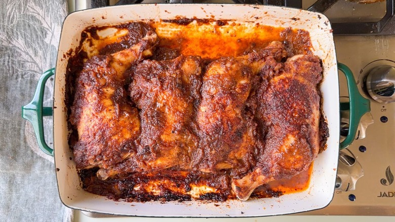 Applesauce barbecue chicken resting in baking dish