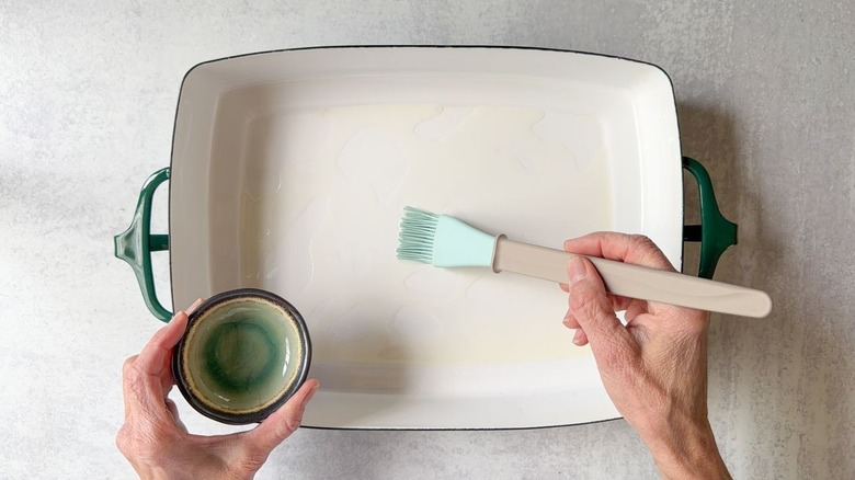 Brushing oil onto a baking dish