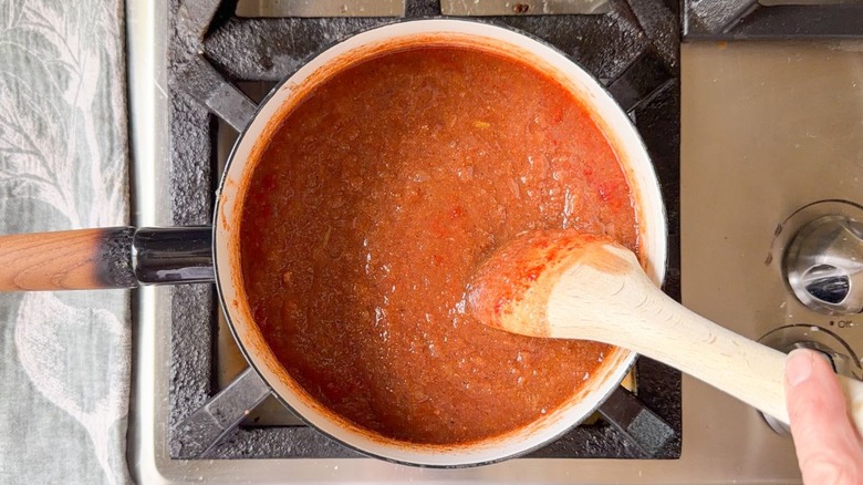 Applesauce barbecue sauce cooking in saucepan on stovetop