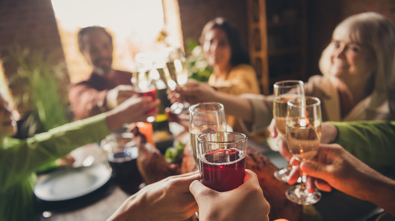 group toasting various drinks 