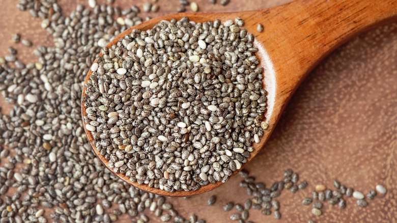 Close up of chia seeds in a wooden spoon