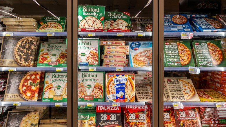Frozen pizzas sold in a grocery store