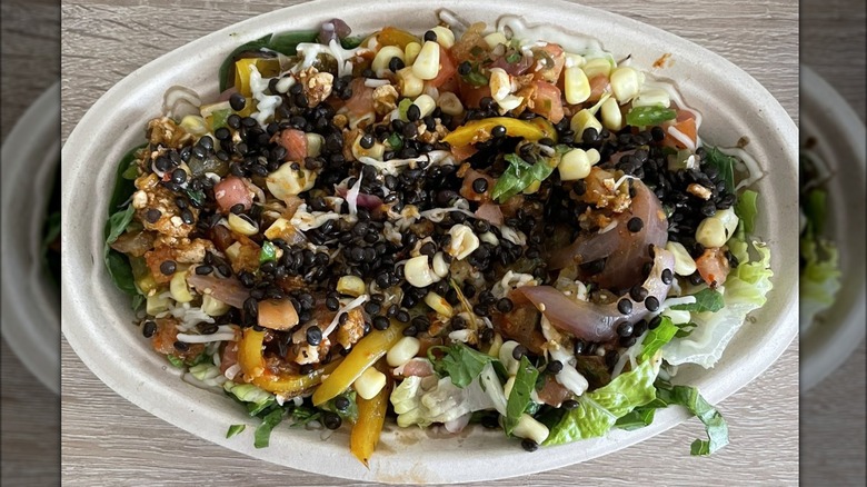 Chipotle veggie bowl with corn beans rice guacamole