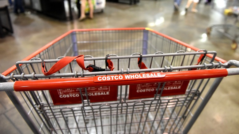 An empty Costco shopping cart inside the store