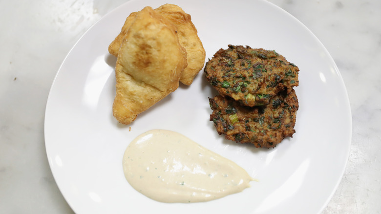 Aruk latke with sauce and fried dough 
