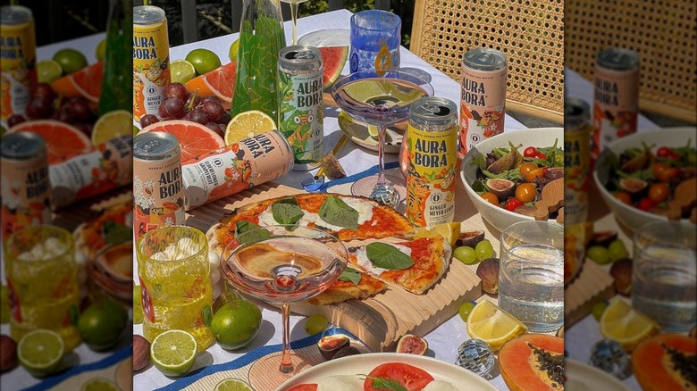 Aura Bora's sparkling waters with an array of food