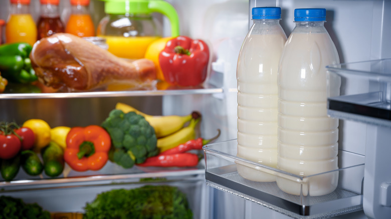 Bottles of milk in the fridge