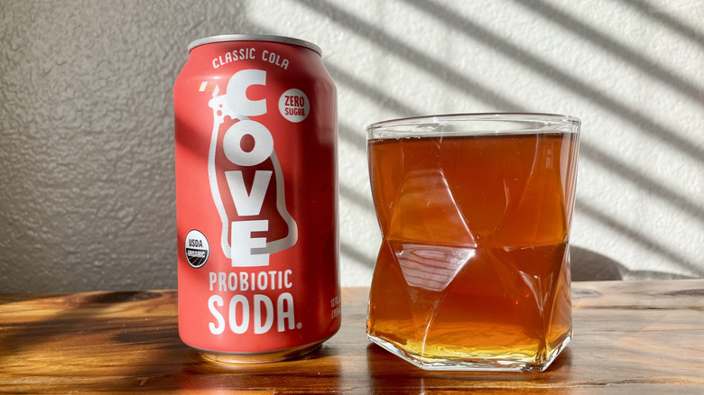 A can of Cove soda poured into glass.