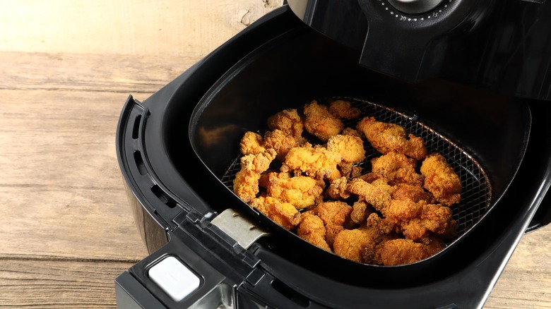 Fried chicken in an air fryer basket