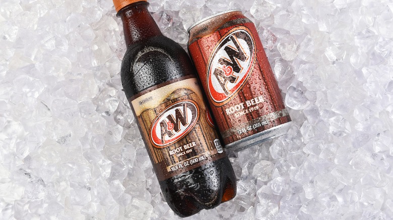 A&W root beer bottle and can on ice