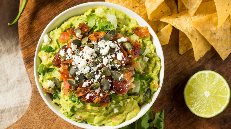 bowl of guacamole with chips