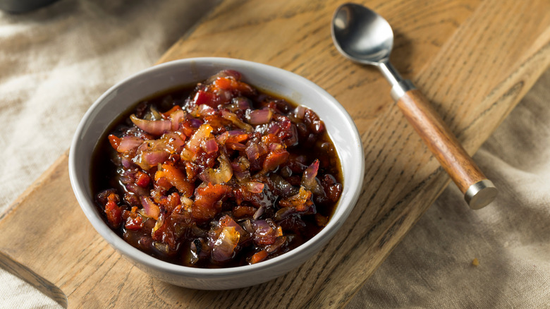 Homemade bacon jam in a bowl with spoon