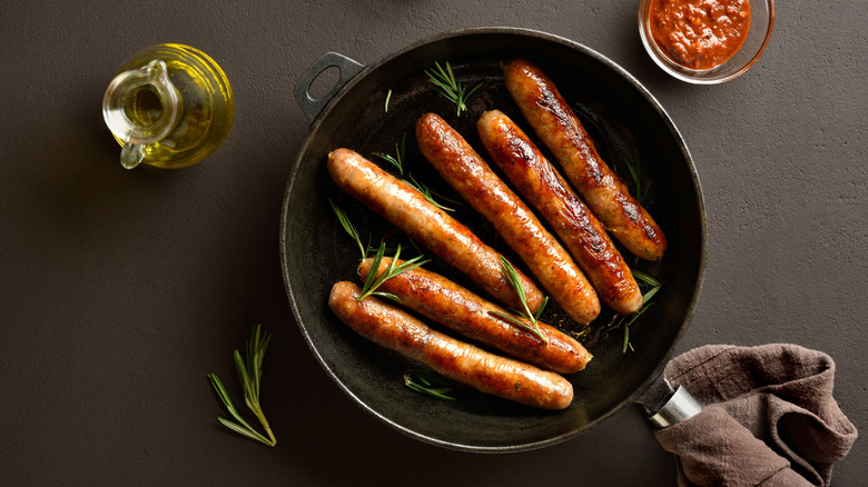 Sausages in a pan.