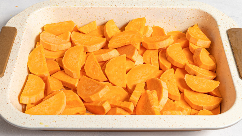 raw yams in baking dish