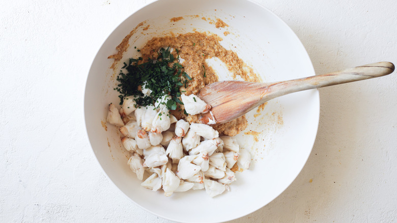 Crab and herbs in bowl