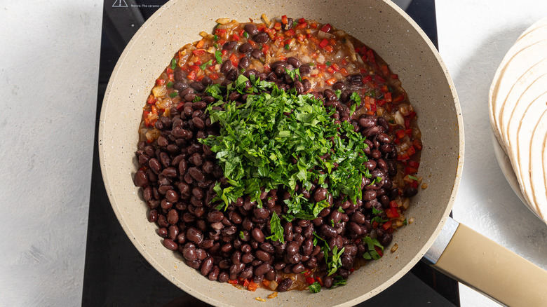 beans and vegetables in pan