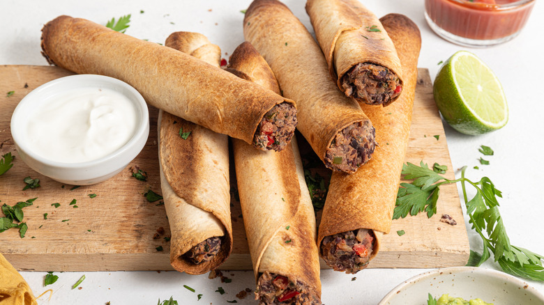 taquitos on wooden board