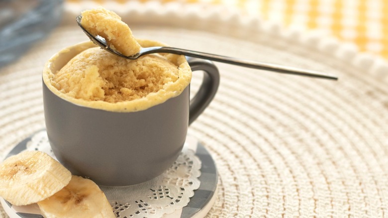 Cake baked in mug with banana slices