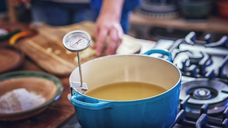 Thermometer in pot of oil