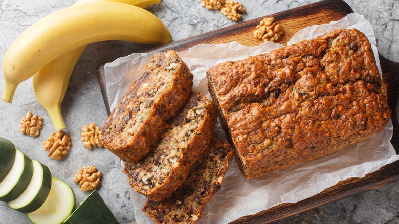 Bananas and zucchini next to fresh zucchini bread