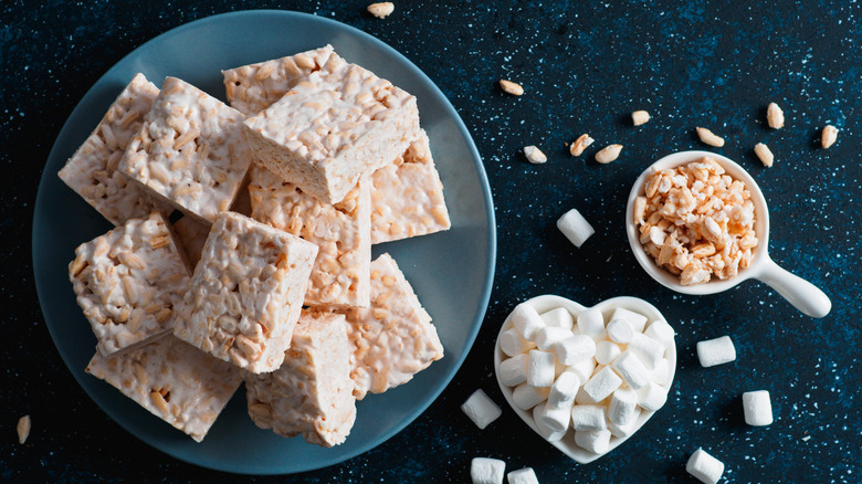 Plate of Rice Krispie treats next to marshmallows