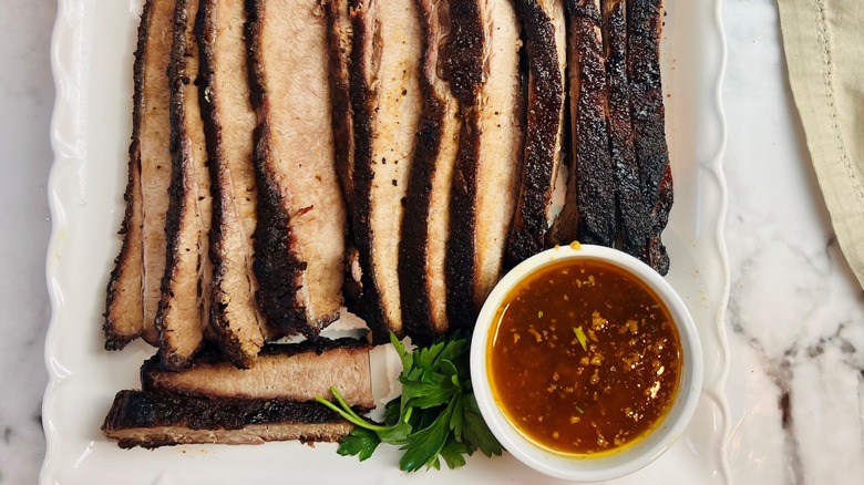 sliced brisket with seasoned butter