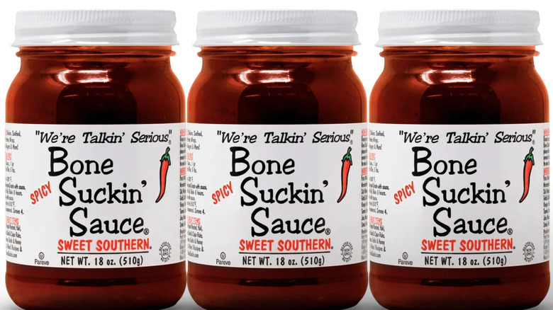 Three cans of Bone Suckin' Sauce