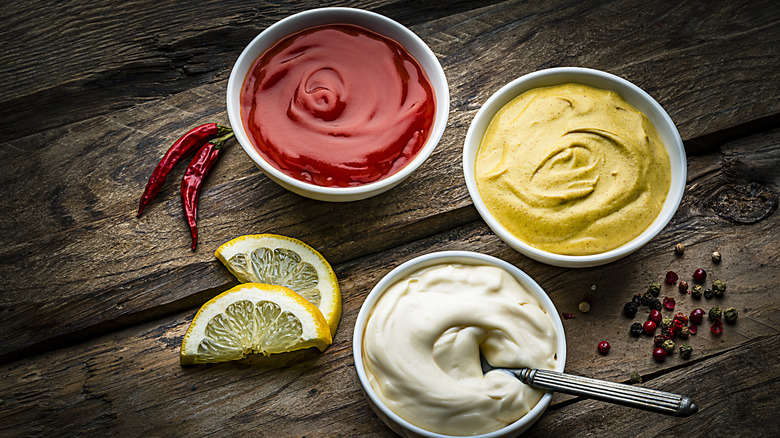 Various condiments in small bowls