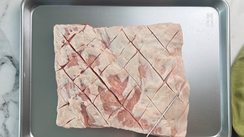 scored raw pork belly 